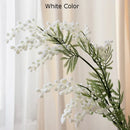 branche de mimosa artificielle avec feuilles de palmier tropicales
