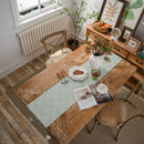 Chemin de table géométrique beige noir pompons bohème