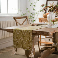 Chemin de table géométrique beige noir à pompons