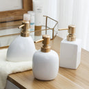 distributeur de savon en céramique avec pompe dorée pour salle de bain