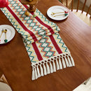 Chemin de table bohème motif aztèque tissé pompons