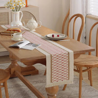 Chemin de table bohème beige motifs géométriques pompons