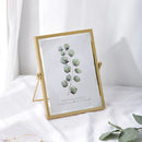 cadre photo en verre flottant avec fleurs pressées décoratif
