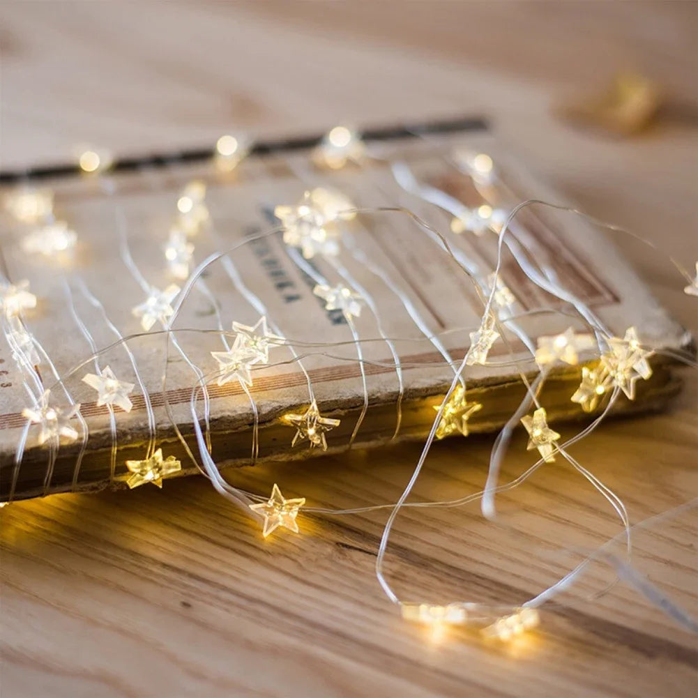 guirlande lumineuse en cuivre avec étoiles décoratives à piles - vue 1 sur 8