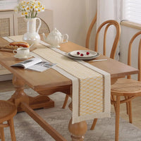 Chemin de table bohème beige pompons motif géométrique