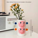 vase en céramique abstrait avec visage humain décoration florale