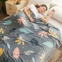 Plaid polaire motifs carreaux et floral pour canapé