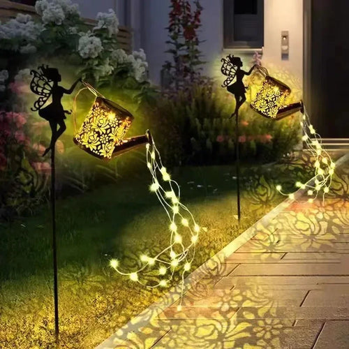 arrosoir solaire avec lumières de jardin et statues de fées