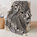 plaid tricoté bohème à pompons motif géométrique doux
