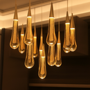 lustre créatif en cristal en forme de goutte d'eau dorée rotatif