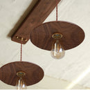 suspension-nordique-en-noyer-noir-sculpt-e-la-main-0.png