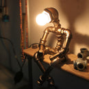 Lampe à poser industrielle LED figure robotique métallique Nile