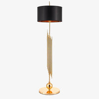 Lampadaire design doré avec abat-jour noir arrondi body