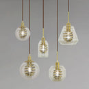 Suspension design en verre avec spirale dorée