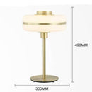 Lampe de chevet moderne LED aux formes arrondies et pied doré Hotel