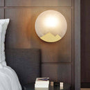 Applique murale design LED avec disque de marbre et métal doré