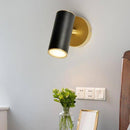 Applique murale LED avec spot cylindrique en métal doré