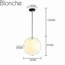 Suspension design LED avec cercle doré et boule en verre