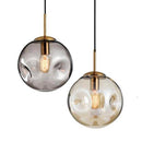 Suspension design à LED boule déformée en verre Head
