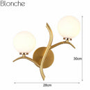 Applique murale design LED dorée avec double boules en verre Luxury