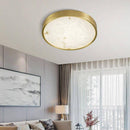 Plafonnier design LED rond en marbre avec bords dorés