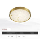 Plafonnier design LED rond en marbre avec bords dorés