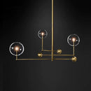 Lustre design LED base en métal doré et globes en verre Zuri
