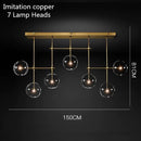 Lustre design LED base en métal doré et globes en verre Zuri