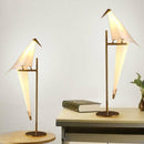 Lampe à poser en forme d'oiseau sur branche dorée