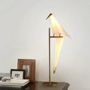 Lampe à poser en forme d'oiseau sur branche dorée