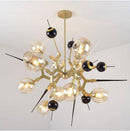 Lustre design à LED moderne doré et noir avec boules en verre et pics