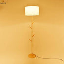 Lampadaire avec abat-jour en tissu et pied en bois à branches